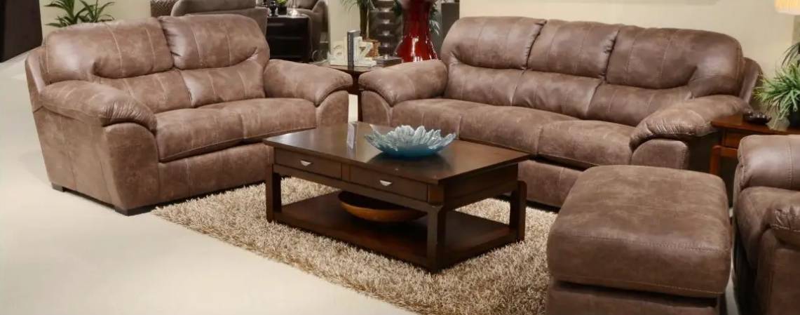 Brown leather sofas and coffee table setup.