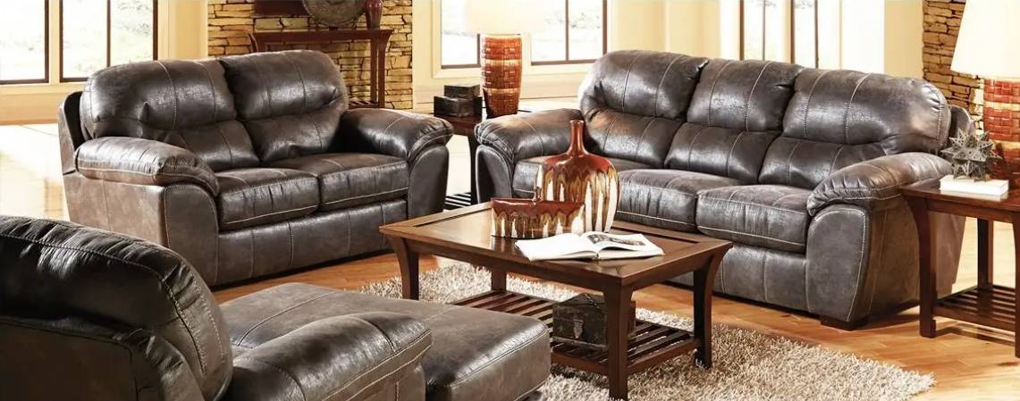 Brown leather sofas in a cozy living room.