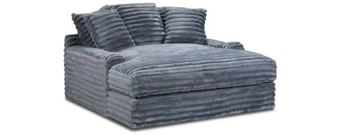 Gray plush oversized chair with striped texture.