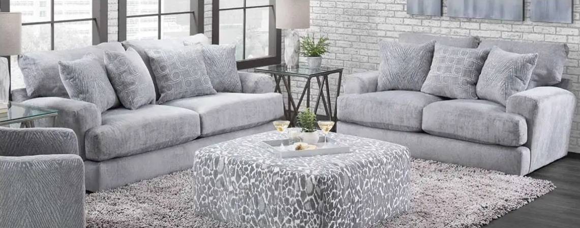 Gray living room with sofas and table.