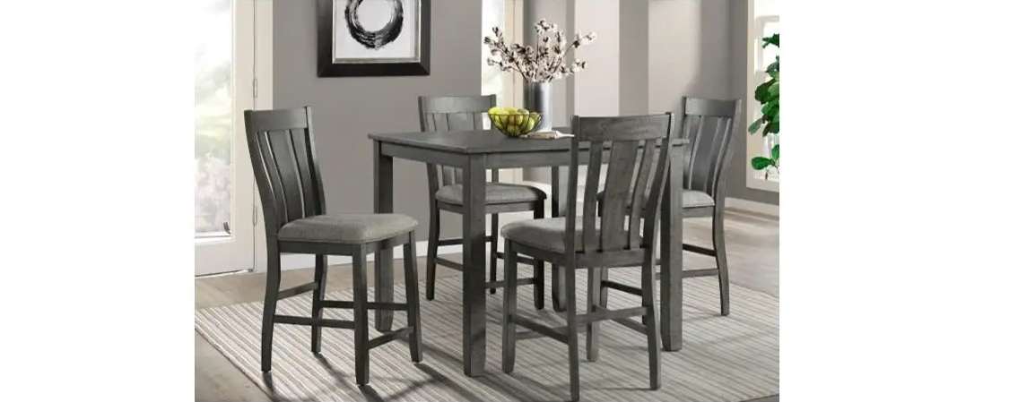 Gray dining set with four chairs.