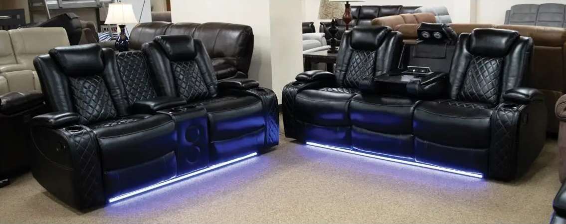 Black leather recliners with blue LED lights.