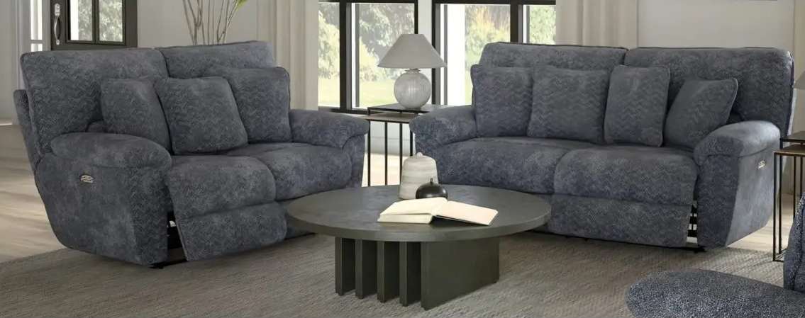 Blue sofas with coffee table in living room.