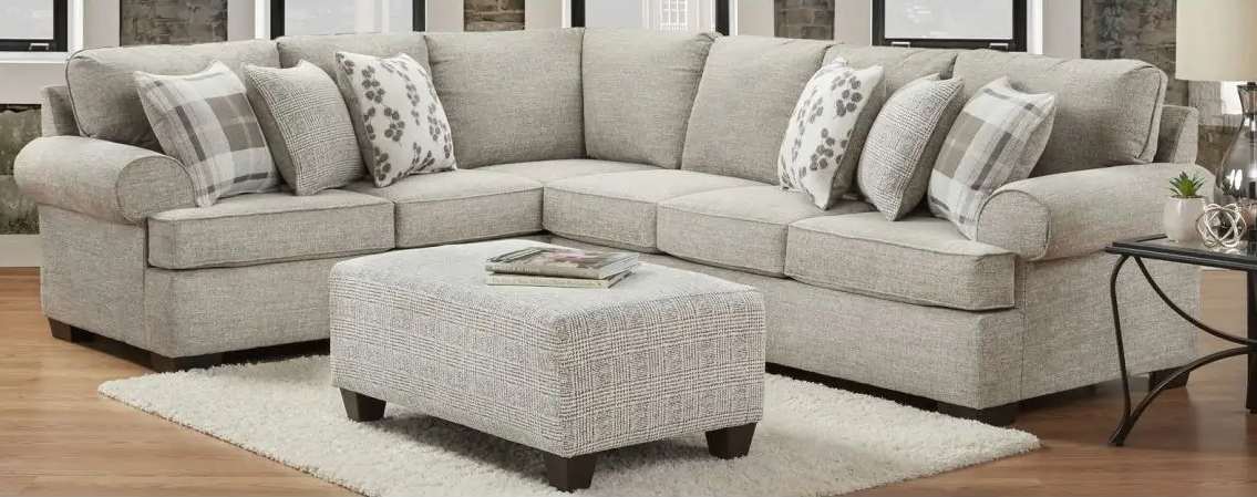 Gray sectional sofa with matching ottoman.