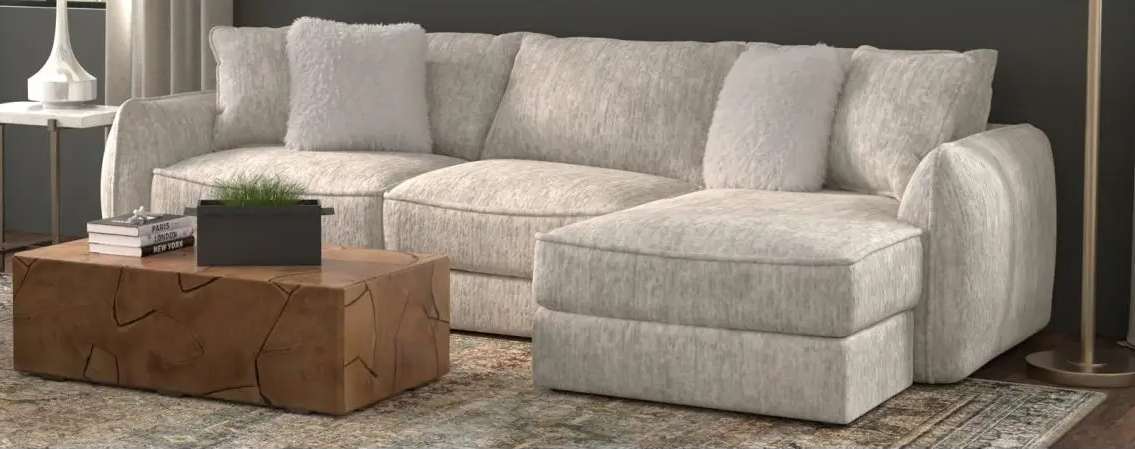 Gray sectional sofa with wooden coffee table.