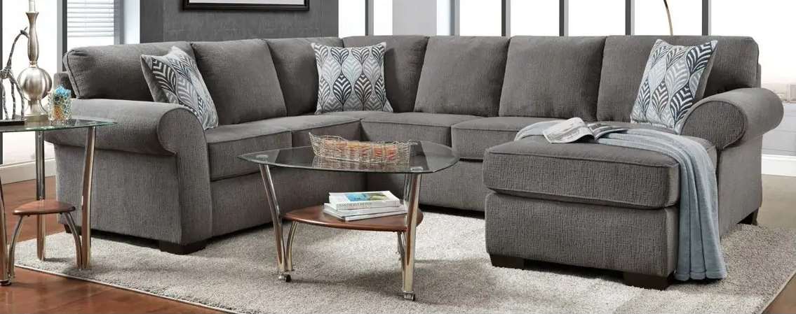 Gray sectional sofa with decorative pillows.
