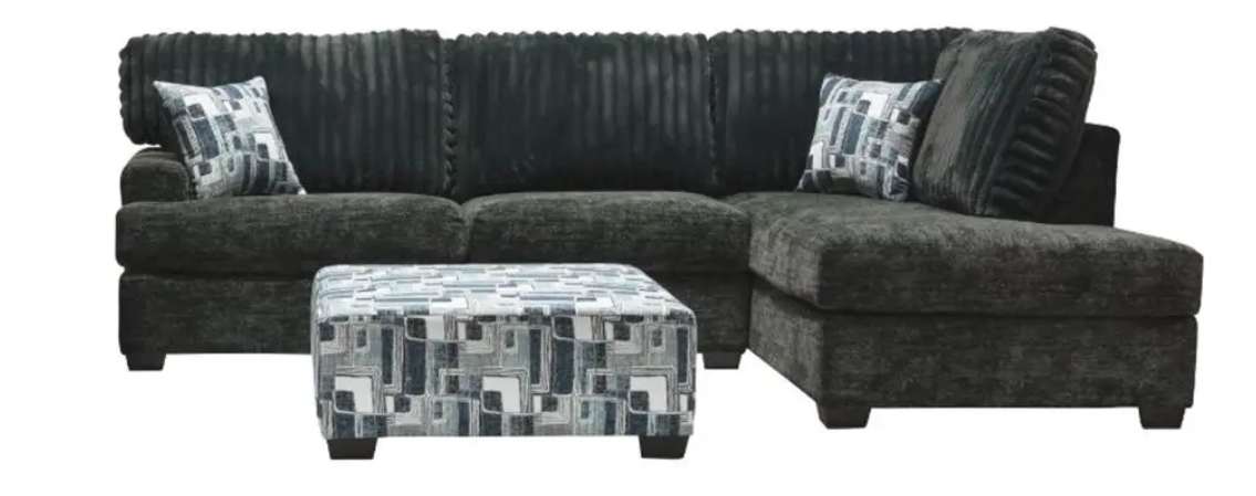 Dark sectional sofa with patterned ottoman.