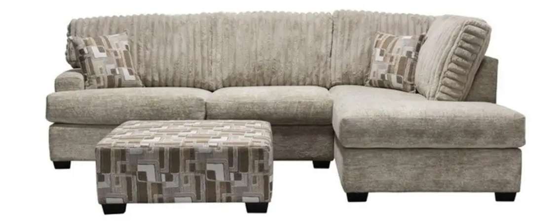 Gray sectional sofa with matching ottoman.